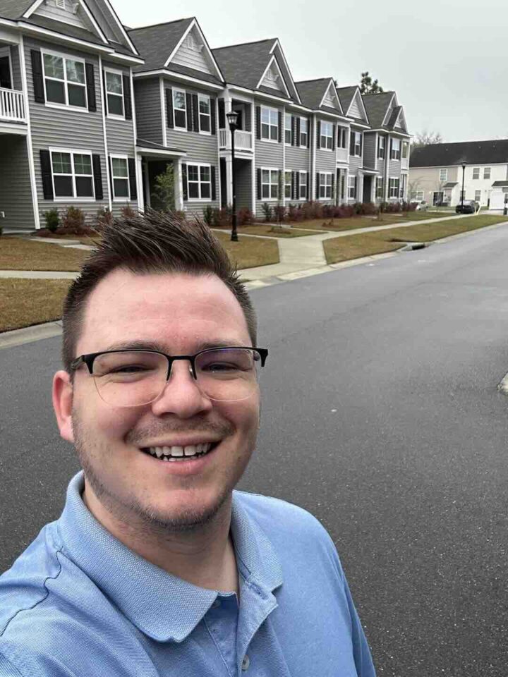 Property manager in front of property