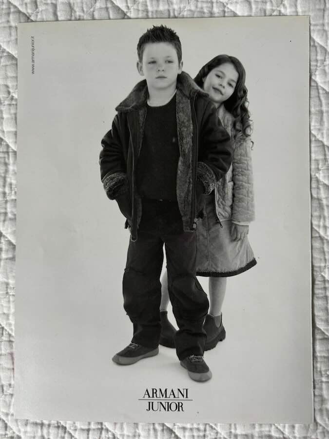 Two children modeling Armani Junior clothing