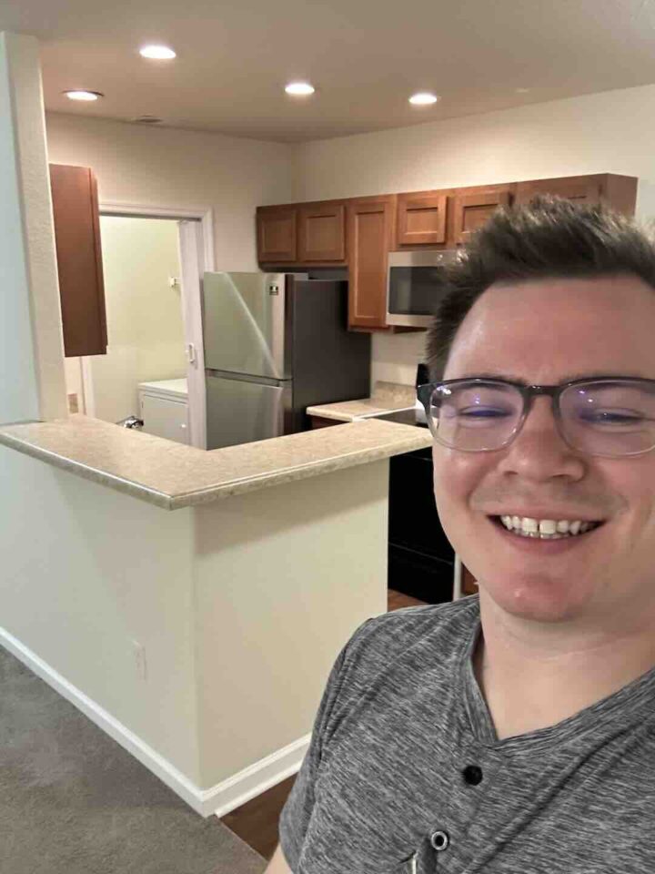 Property manager in kitchen of property